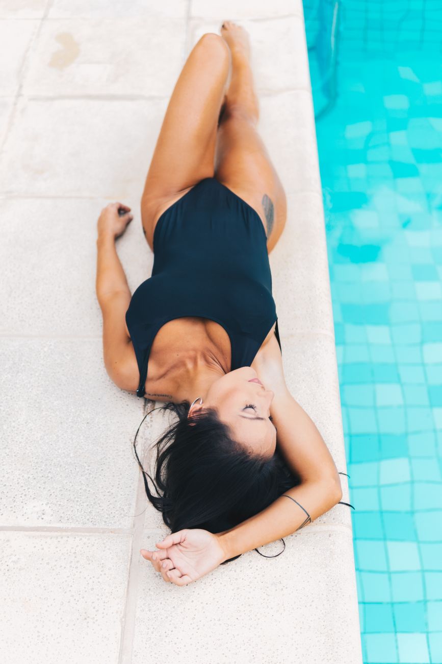 Woman in a bikini by the water