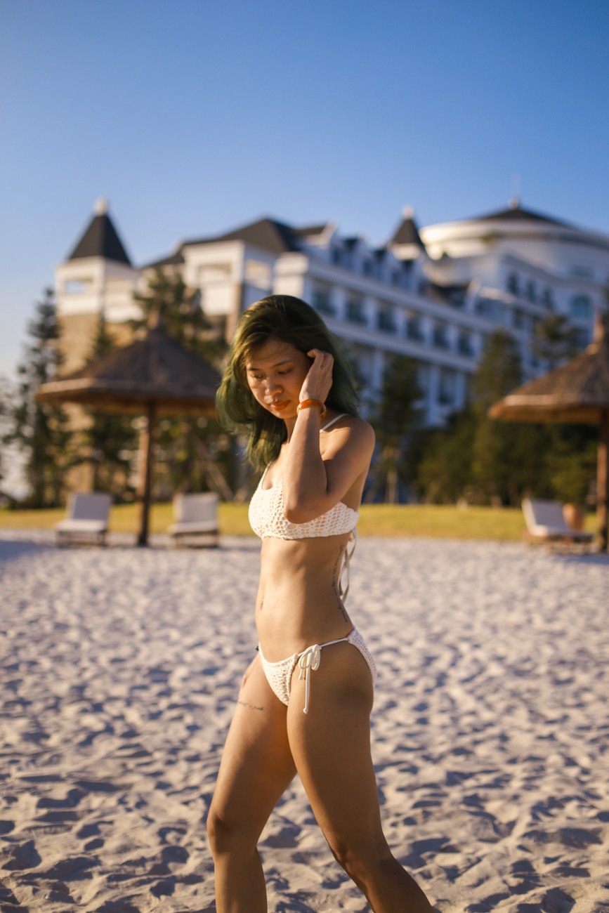 Woman in a bikini by the water